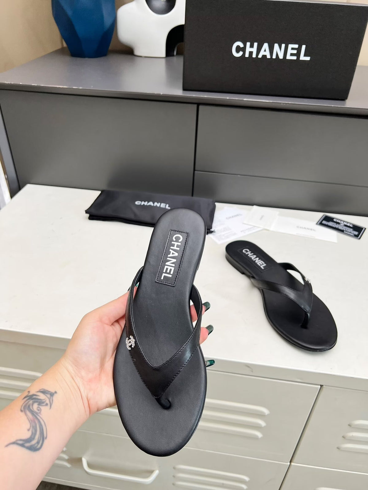 CHANEL THONG SLIPPERS IN BLACK COWHIDE